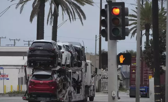New Mazda SUVs are transported at the Port of Long Beach in Long Beach, Calif., Wednesday, March 26, 2025. (AP Photo/Damian Dovarganes)
