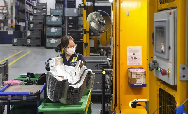 FILE - An employee works on the production line at the Martinrea auto parts manufacturing plant that supplies auto parts to Canada and U.S. plants, in Woodbridge, Ontario, Feb. 3, 2025. (Chris Young/The Canadian Press via AP, File)