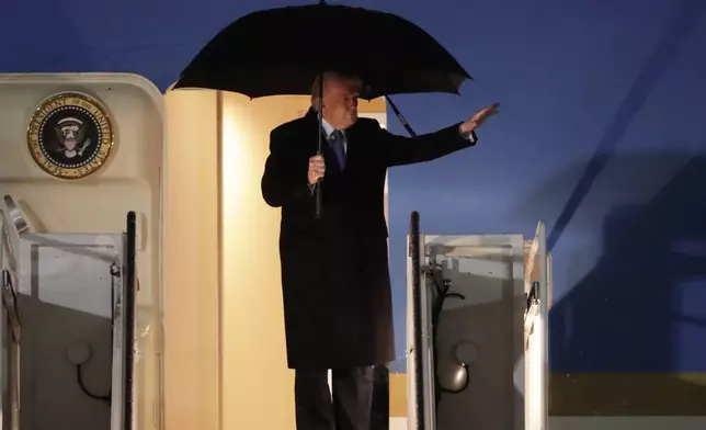 President Donald Trump waves from the stairs of Air Force One upon his arrival at Joint Base Andrews, Md., Monday, March 17, 2025 (AP Photo/Luis M. Alvarez)