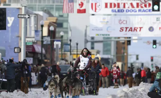 Samantha LaLonde (3), of Farmington Hills, Michigan, mushes during the Ceremonial Start of the Iditarod Trail Sled Dog Race in Anchorage, Alaska., Saturday, March 1, 2025. (AP Photo/Amanda Loman)