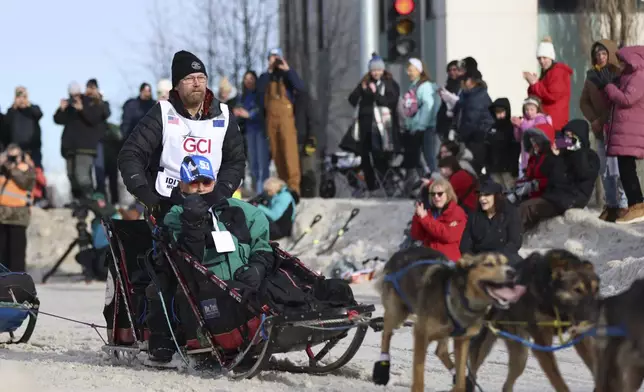 Mitch Seavey (32), of Seward, Alaska, mushes during the Ceremonial Start of the Iditarod Trail Sled Dog Race in Anchorage, Alaska., Saturday, March 1, 2025. (AP Photo/Amanda Loman)