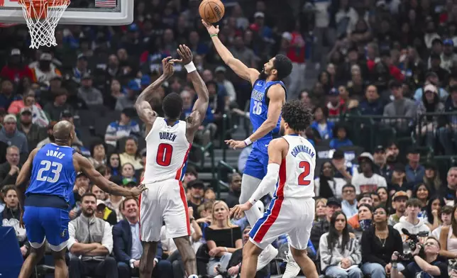 Dallas Mavericks' Spencer Dinwiddie heads toward the basket during the first half of an NBA basketball game against the Detroit Pistons, Friday, March 21, 2025, in Dallas, Texas. (AP Photo/Albert Pena)