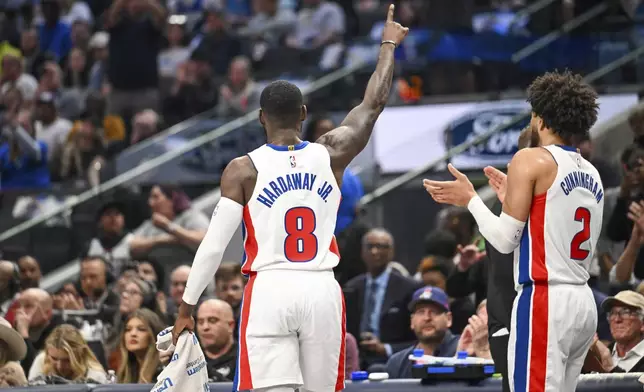 Detroit Pistons forward Tim Hardaway Jr. is honored during a timeout in the first half of an NBA basketball game against the Dallas Mavericks, Friday, March 21, 2025, in Dallas, Texas. (AP Photo/Albert Pena)