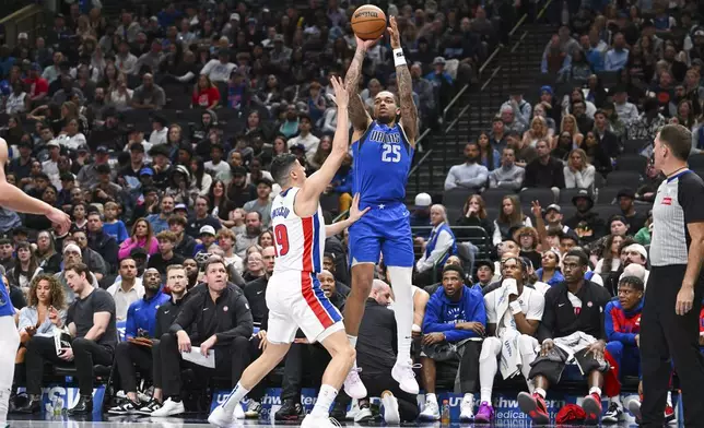 Dallas Mavericks forward P.J. Washington takes a shot over Detroit Pistons forward Simone Fontecchio during the second half of an NBA basketball game, Friday, March 21, 2025, in Dallas, Texas. (AP Photo/Albert Pena)