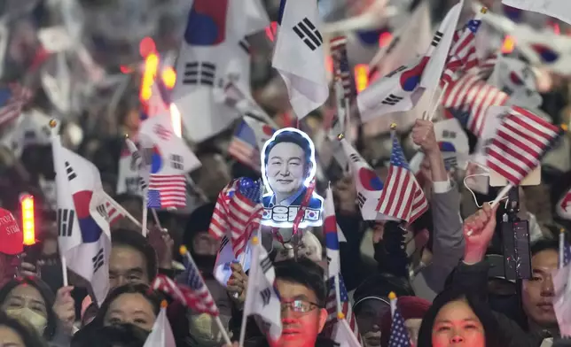 Supporters of impeached South Korean President Yoon Suk Yeol stage a rally to oppose his impeachment near the presidential residence in Seoul, South Korea, Saturday, March 8, 2025. (AP Photo/Ahn Young-joon)