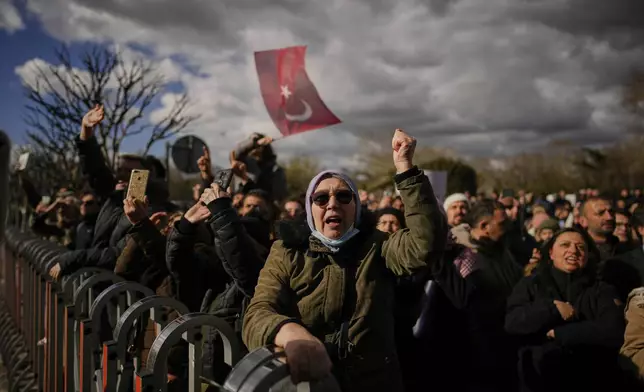 People gather outside the City Hall to protest the arrest of Istanbul Mayor Ekrem Imamoglu in Istanbul, Turkey, Wednesday, March 19, 2025. (AP Photo/Emrah Gurel)