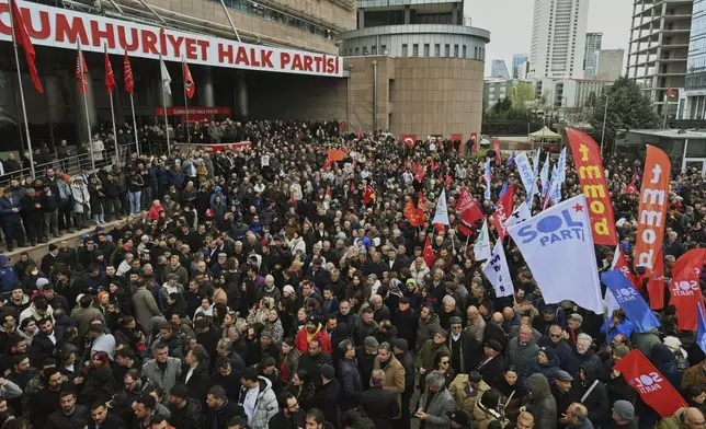 People gather outside the headquarters of the opposition Republican People's Party or (CHP) to protest following the arrest of Istanbul Mayor Ekrem Imamoglu in Ankara, Turkey, on Wednesday, March 19, 2025. (AP Photo/Ali Unal)
