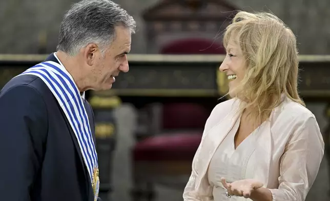 Uruguay's incoming President Yamandu Orsi and Vice President Carolina Cosse attend an Inauguration Day ceremony, in Montevideo, Uruguay, Saturday, March 1, 2025. (AP Photo/Matilde Campodonico)