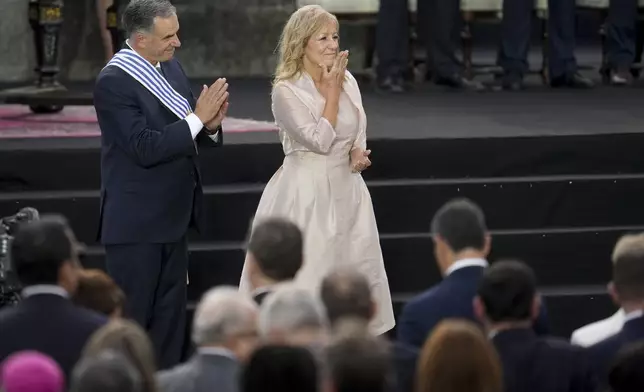 Uruguay's incoming President Yamandu Orsi and Vice President Carolina Cosse attend an Inauguration Day ceremony, in Montevideo, Uruguay, Saturday, March 1, 2025. (AP Photo/Matilde Campodonico)