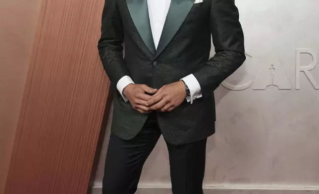 Jon M. Chu arrives at the Oscars on Sunday, March 2, 2025, at the Dolby Theatre in Los Angeles. (Photo by Jordan Strauss/Invision/AP)