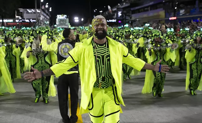 The drum director from the Mocidade samba school gestures during Carnival celebrations at the Sambadrome in Rio de Janeiro, Tuesday, March 4, 2025. (AP Photo/Bruna Prado)
