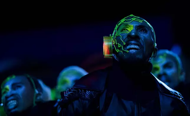 Performers from the Mocidade samba school dance during Carnival celebrations at the Sambadrome in Rio de Janeiro, Tuesday, March 4, 2025. (AP Photo/Bruna Prado)