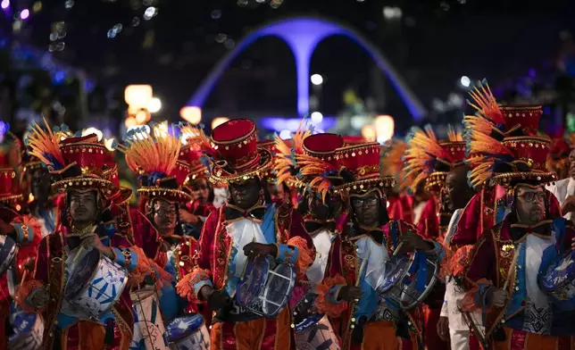 Musicians from the Beija-Flor samba school perform during Carnival celebrations at the Sambadrome in Rio de Janeiro, Monday, March 3, 2025. (AP Photo/Bruna Prado)