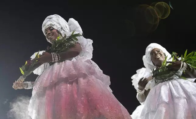 Performers from the Salgueiro samba school dance during Carnival celebrations at the Sambadrome in Rio de Janeiro, early Tuesday, March 4, 2025. (AP Photo/Bruna Prado)