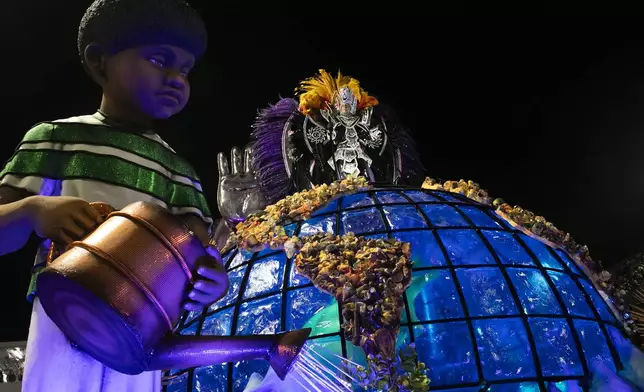 A performer from the Mocidade samba school dances on a float during Carnival celebrations at the Sambadrome in Rio de Janeiro, Tuesday, March 4, 2025. (AP Photo/Bruna Prado)