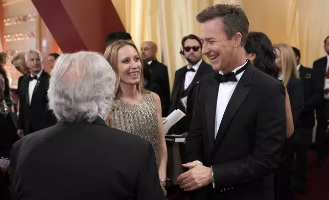 Shauna Robertson, left, and Edward Norton arrive at the Oscars on Sunday, March 2, 2025, at the Dolby Theatre in Los Angeles. (AP Photo/John Locher)