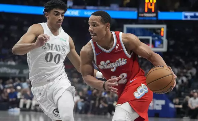 Memphis Grizzlies guard Desmond Bane (22) drives against Dallas Mavericks guard Max Christie (00) during the first half of an NBA basketball game in Dallas, Friday, March 7, 2025. (AP Photo/LM Otero)