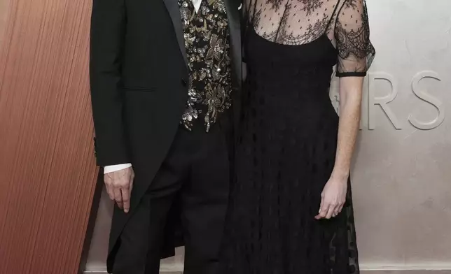 Raj Kapoor, left, and Katy Mullan arrive at the Oscars on Sunday, March 2, 2025, at the Dolby Theatre in Los Angeles. (Photo by Jordan Strauss/Invision/AP)