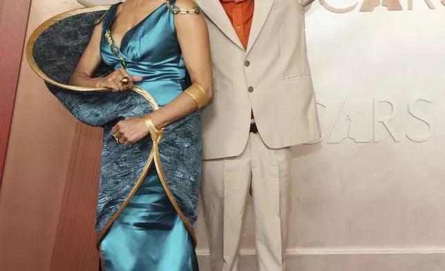 Kayo Shekoni, left, and Johan Grimonprez arrive at the Oscars on Sunday, March 2, 2025, at the Dolby Theatre in Los Angeles. (Photo by Jordan Strauss/Invision/AP)