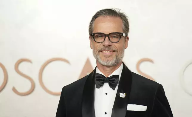 Guy Pearce arrives at the Oscars on Sunday, March 2, 2025, at the Dolby Theatre in Los Angeles. (AP Photo/Jae C. Hong)