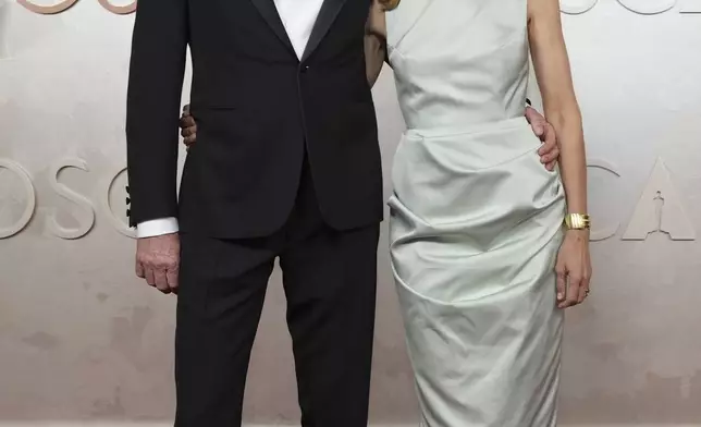 Conan O'Brien, left, and Liza Powel O'Brien arrive at the Oscars on Sunday, March 2, 2025, at the Dolby Theatre in Los Angeles. (AP Photo/Jae C. Hong)