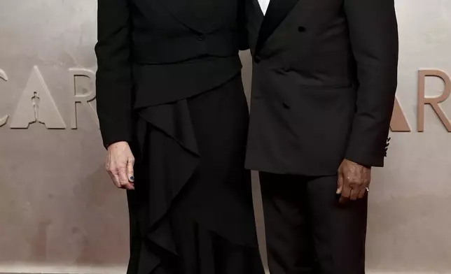 Ellen Kuras, left, and Giancarlo Esposito arrive at the Oscars on Sunday, March 2, 2025, at the Dolby Theatre in Los Angeles. (Photo by Richard Shotwell/Invision/AP)