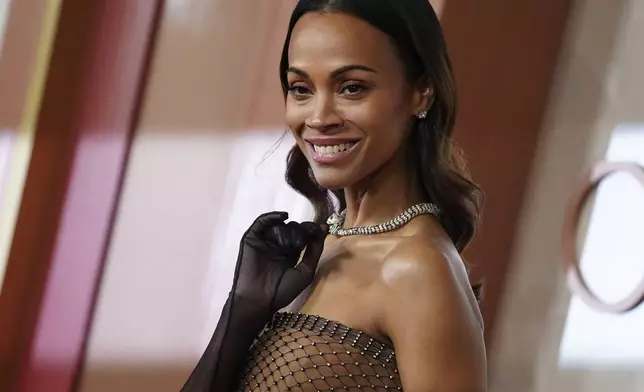 Zoe Saldana arrives at the Oscars on Sunday, March 2, 2025, at the Dolby Theatre in Los Angeles. (Photo by Jordan Strauss/Invision/AP)
