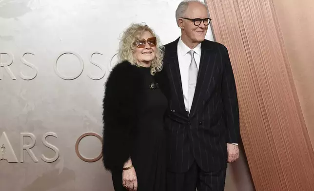 Mary Yeager, left, and John Lithgow arrive at the Oscars on Sunday, March 2, 2025, at the Dolby Theatre in Los Angeles. (Photo by Richard Shotwell/Invision/AP)
