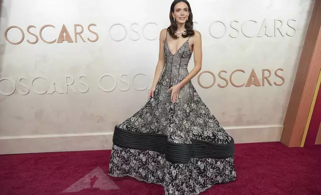 CORRECTS NAME-Stacy Martin arrives at the Oscars on Sunday, March 2, 2025, at the Dolby Theatre in Los Angeles. (AP Photo/Jae C. Hong)
