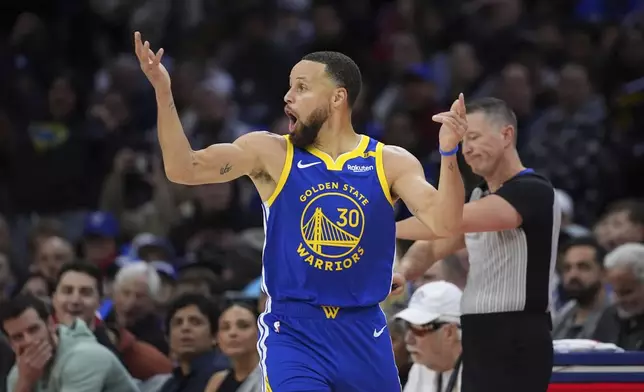 Golden State Warriors' Stephen Curry reacts after being fouled during the first half of an NBA basketball game against the Philadelphia 76ers Saturday, March 1, 2025, in Philadelphia. (AP Photo/Matt Slocum)