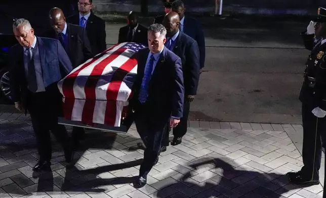 Former Houston Mayor and U.S. Rep. Sylvester Turner is carried into City Hall where he will lie in state in Houston, Tuesday, March 11, 2025. (Brett Coomer /Houston Chronicle via AP)