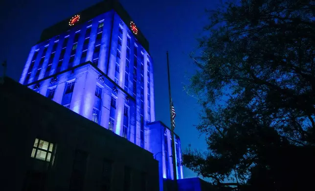 City Hall is lit up in blue in honor of former Mayor and U.S. Rep. Sylvester Turner where he will lie in state in Houston, Tuesday, March 11, 2025. (Brett Coomer /Houston Chronicle via AP)