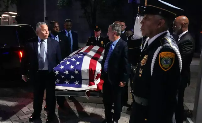 Former Houston Mayor and U.S. Rep. Sylvester Turner is carried into City Hall where he will lie in state in Houston, Tuesday, March 11, 2025. (Brett Coomer /Houston Chronicle via AP)