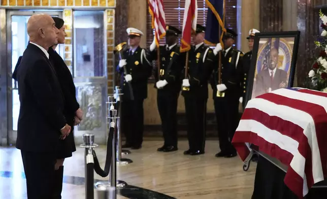 Houston Mayor John Whitmire, left, pay his respects as the remains of U.S. Rep. Sylvester Turner of Texas lie in state at Houston City Hall on Tuesday, March 11, 2025, in Houston. (AP Photo/Ashley Landis)