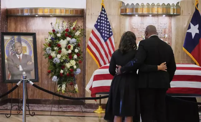 People pay their respects as the remains of U.S. Rep. Sylvester Turner of Texas lie in state at Houston City Hall on Tuesday, March 11, 2025, in Houston. (AP Photo/Ashley Landis)
