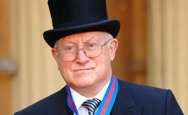 FILE- Former Soviet spy Oleg Gordievsky after receiving the Companion of the Most Distinguished Order of St Michael and Saint George from Queen Elizabeth II at Buckingham Palace in London, Oct. 17, 2007. (Fiona Hanson/PA via AP, file)