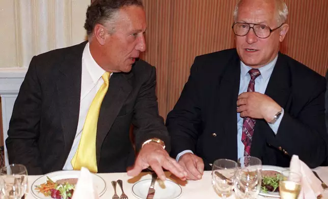FILE - File photo dated 23/04/97 of author Frederick Forsyth, left. with Foyles luncheon chairman Oleg Gordievsky, at the Foyle's Literary,in London. Gordievsky died March 4 in England at the age of 86. (David Cheskin/PA via AP)