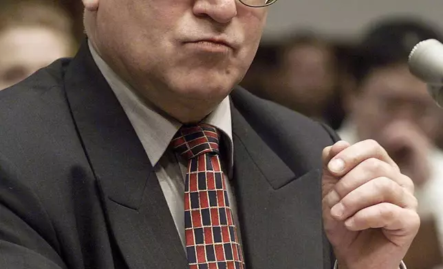 FILE - In this Oct. 26, 1999 file photo, Oleg Gordievsky, a former deputy head of the KGB in London, prepares to testify before a House Armed Services Subcommittee in Washington. He died March 4 in England at the age of 86. (AP Photo/Dennis Cook, File)