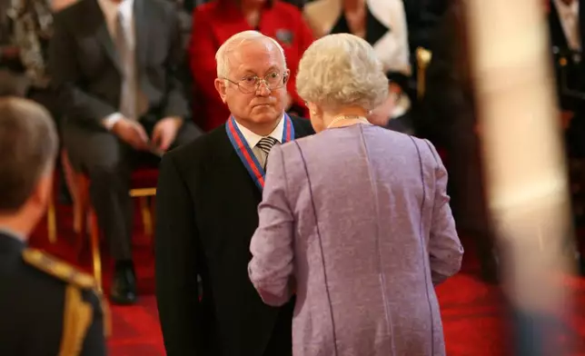 Former Soviet spy Oleg Gordievsky after receives the Companion of the Most Distinguished Order of St Michael and Saint George from Queen Elizabeth II at Buckingham Palace in London, Oct. 17, 2007. (Martin Keene/PA via AP, file)
