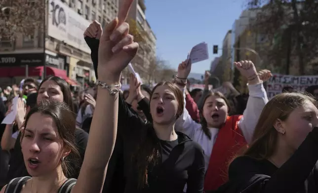 High school students shout slogans during a rally, on the third and final day of a censure motion debate against the conservative government in parliament over a deadly rail disaster nearly two years ago, in Athens, Greece, Friday, March 7, 2025. (AP Photo/Thanassis Stavrakis)