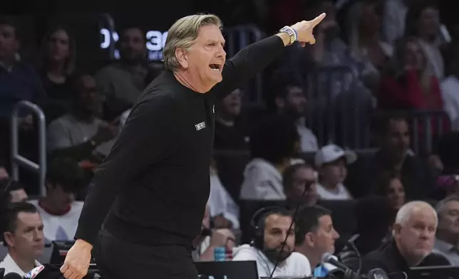 Minnesota Timberwolves head coach Chris Finch gestures during the second half of an NBA basketball game against the Miami Heat, Friday, March 7, 2025, in Miami. (AP Photo/Marta Lavandier)