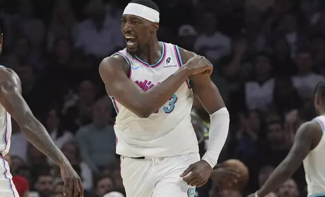 Miami Heat center Bam Adebayo (13) gestures after scoring during the second half of an NBA basketball game against the Minnesota Timberwolves, Friday, March 7, 2025, in Miami. (AP Photo/Marta Lavandier)