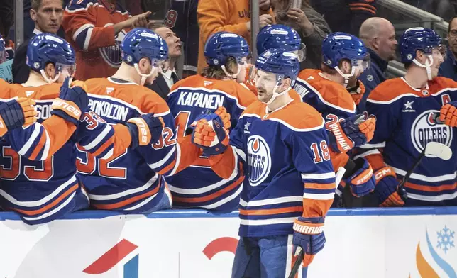 Edmonton Oilers' Zach Hyman (18) celebrates a goal against the Dallas Stars during the first period of an NHL hockey game in Edmonton, Alberta, Saturday, March 8, 2025. (Jason Franson/The Canadian Press via AP)