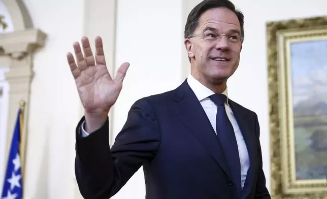 NATO Secretary General Mark Rutte waves to the members of the media prior to the start of his meeting with the members of the Bosnian Presidency in Sarajevo, Bosnia, Monday, March 10, 2025. (AP Photo/Armin Durgut)