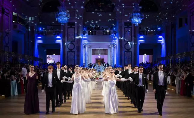 Young people participate in the opening ceremony of the Lawyers' Ball in Vienna, Austria, Saturday, March 1, 2025. (AP Photo/Denes Erdos)