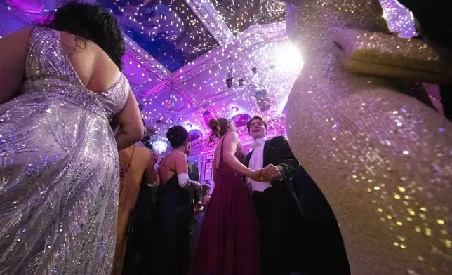 People dance after the opening ceremony of the Lawyers' Ball in Vienna, Austria, Saturday, March 1, 2025. (AP Photo/Denes Erdos)