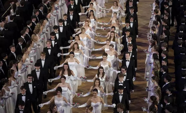 Around 700 young people opened the Elmayer-Kränzchen this year, a Traditional Ball of the Elmayer Dance School in Vienna, Austria, Tuesday, March 4, 2025. (AP Photo/Denes Erdos)