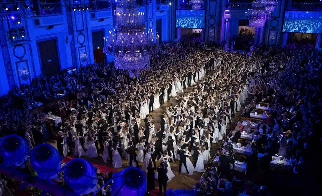 Young people dance waltz during the opening ceremony of the Elmayer-Kränzchen, a Traditional Ball of the Elmayer Dance School in Vienna, Austria, Tuesday, March 4, 2025. (AP Photo/Denes Erdos)