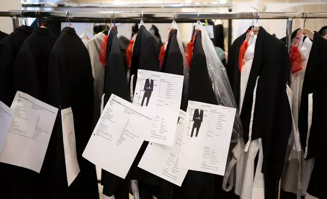 Prepared tailcoats and tuxedos wait to be rented in Lambert Hofer, a renowned costume workshop in Vienna, Austria, Wednesday, Febr 26, 2025. (AP Photo/Denes Erdos)
