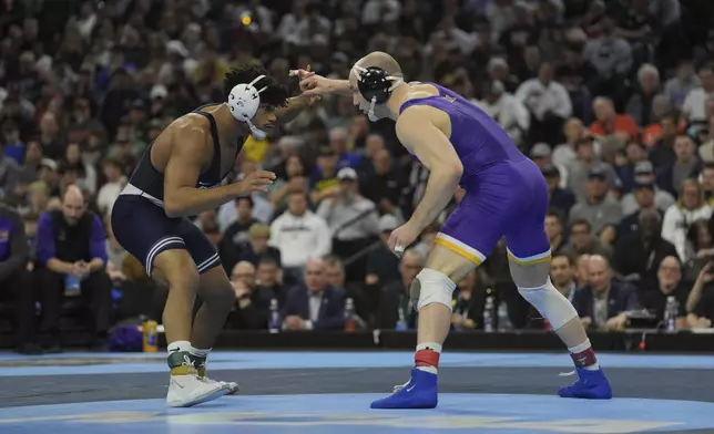 Penn State's Carter Starocci, left, takes on Northern Iowa's Parker Keckeisen during a 184-pound match in the finals at the NCAA wrestling championship, Saturday, March 22, 2025, in Philadelphia. (AP Photo/Matt Rourke)